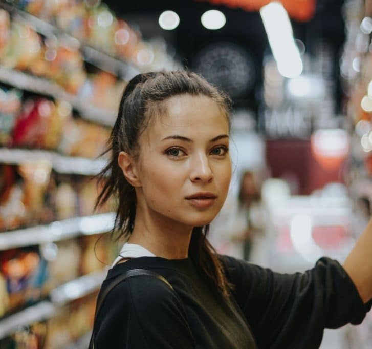 woman in supermarket aisle
